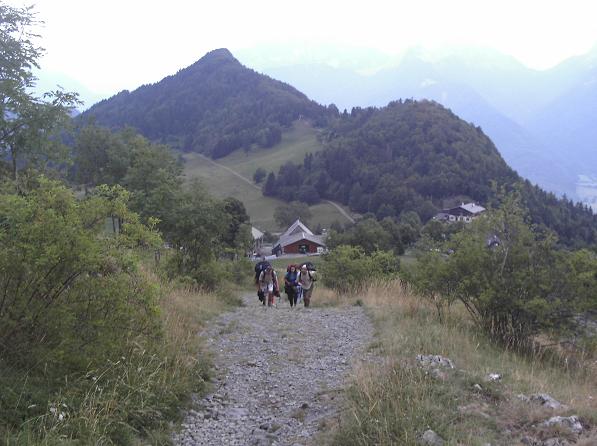 Paraglider pilots making their way to launch - Annecy