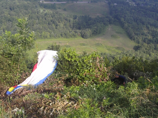 Mukrim recovering his paraglider