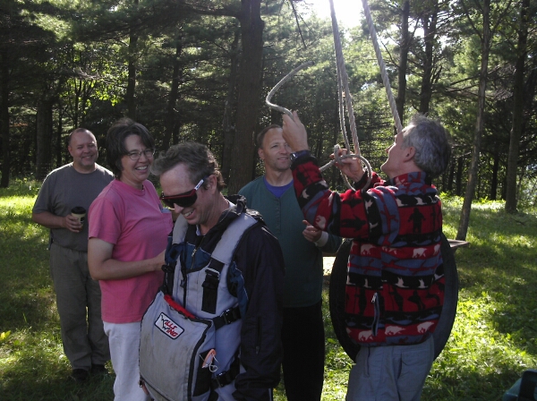 Hangglider pilots trying out a harness